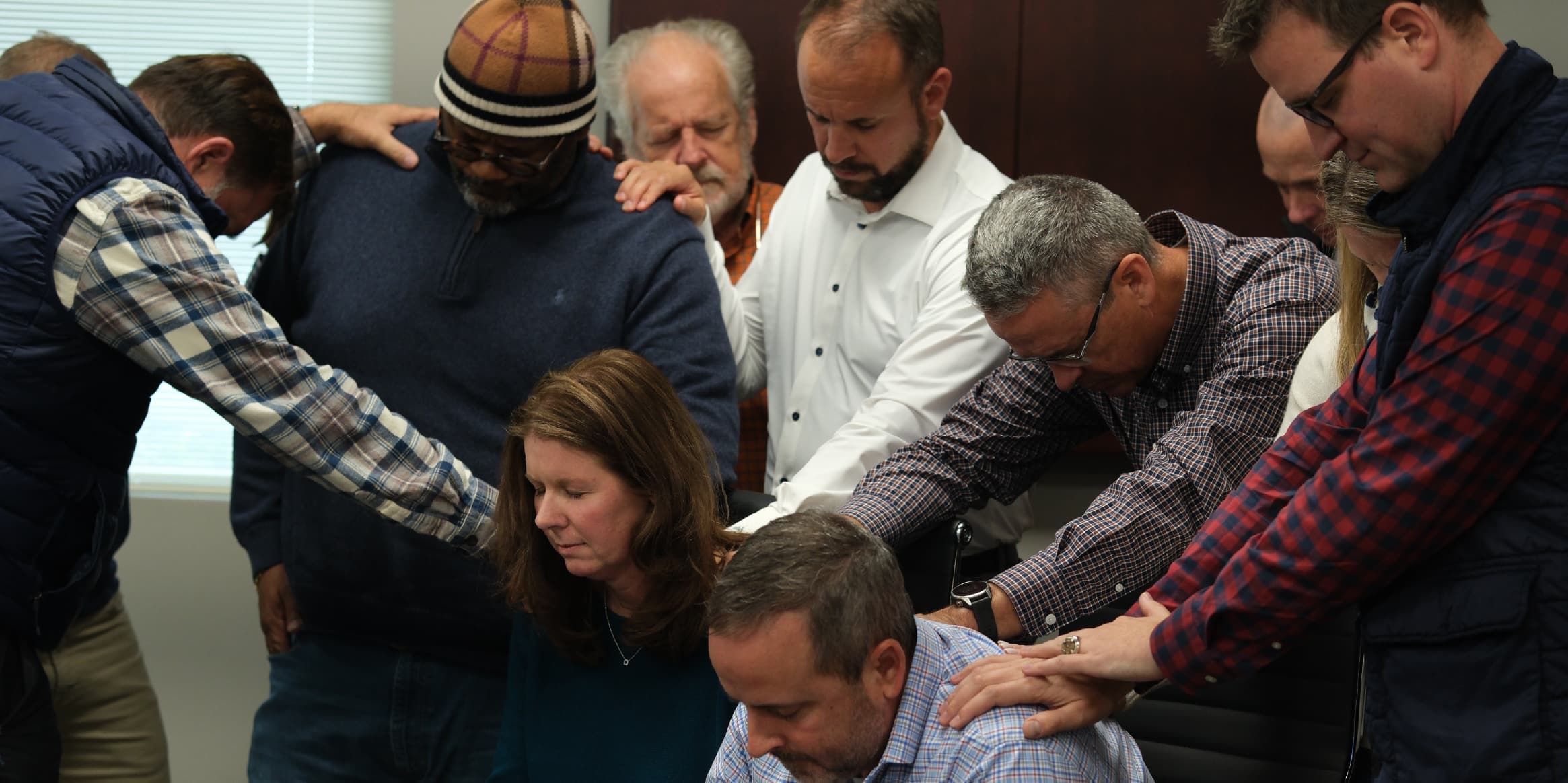 People praying over people