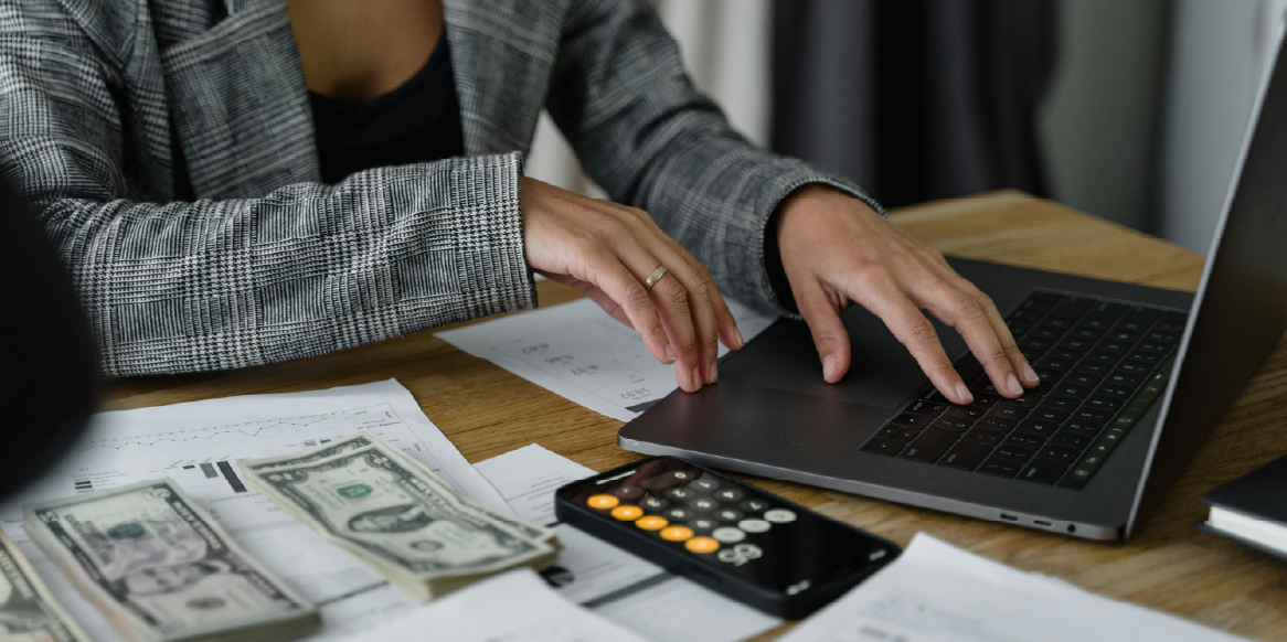 Woman at a computer planning out budget