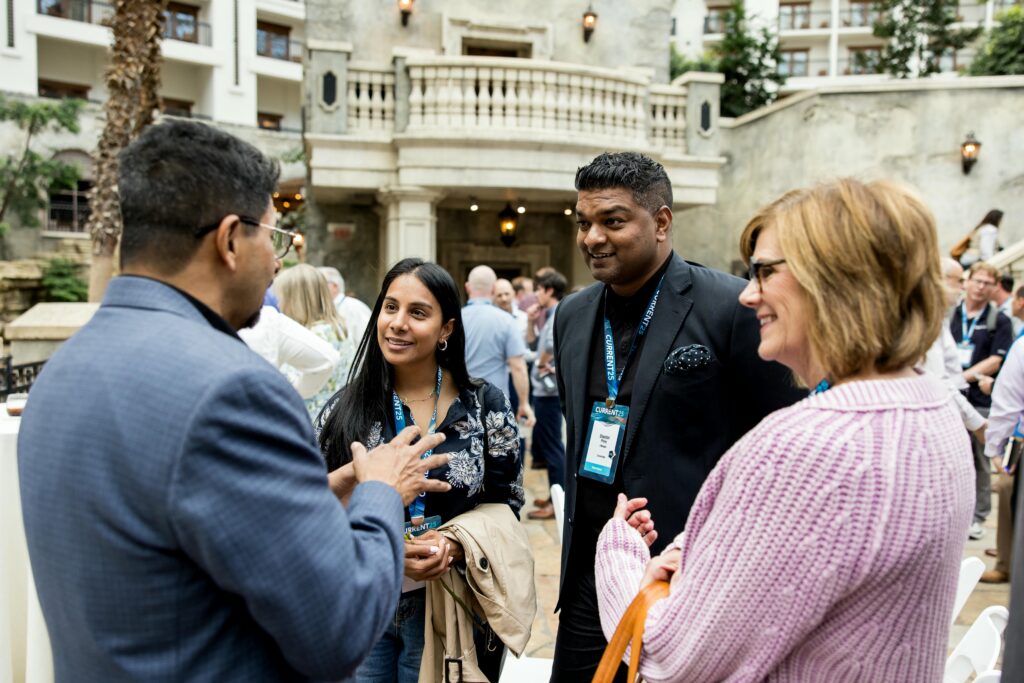 C12 members interacting and smiling at CURRENT25